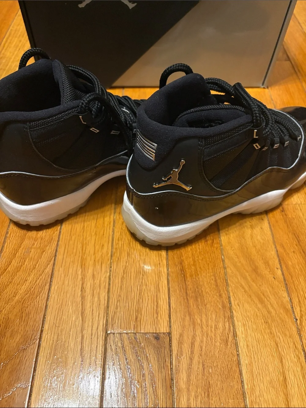 Air Jordan 11 Retro Black Patent and White-Trim High-Top Sneakers